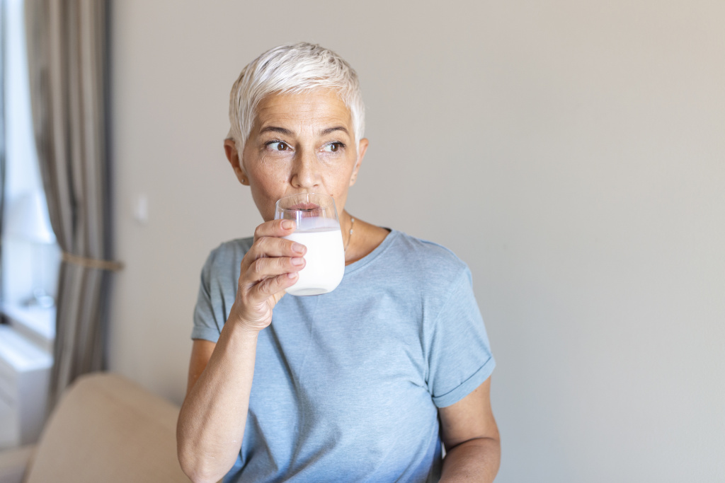 senior-woman-holding-glass-milk-home-middle-age-woman-drinking-glass-fresh-milk-with-happy-face-standing-smiling-with-confident-smile-showing-teeth.jpg